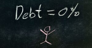 (debt = 0% written on a chalkboard)