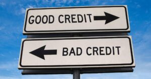 (opposite direction road signs that lead to good credit and bad credit)