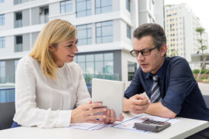 Financial professional guiding a couple through debt management options.